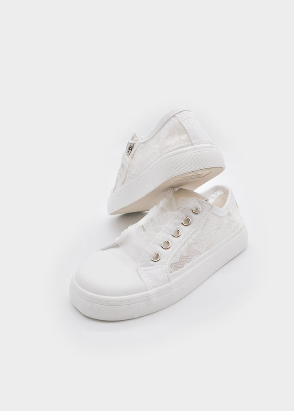 Perforated athletic shoe