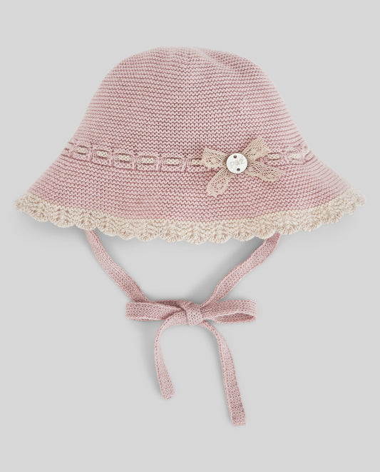 Cappellino neonata Paz Rodriguez Val in maglia rosa con bordo in pizzo