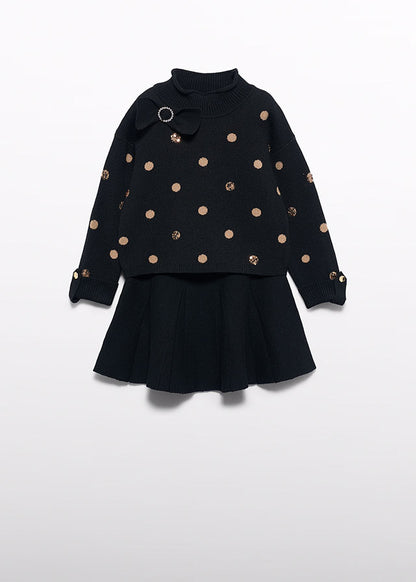 Compl. gonna tricot pois