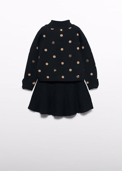 Compl. gonna tricot pois